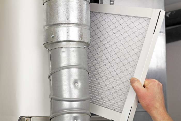hvac contractor checking air filter